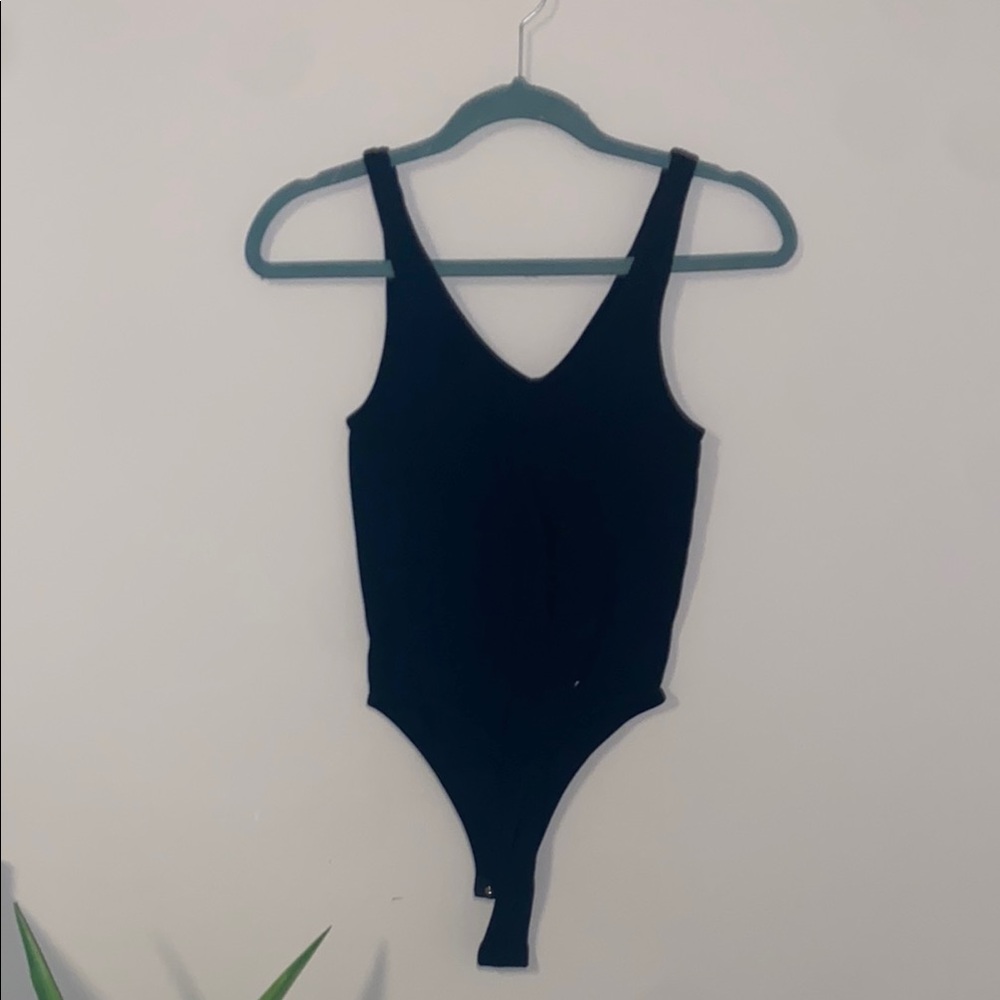 Black Bodysuit with V-Neckline and High-Cut Design